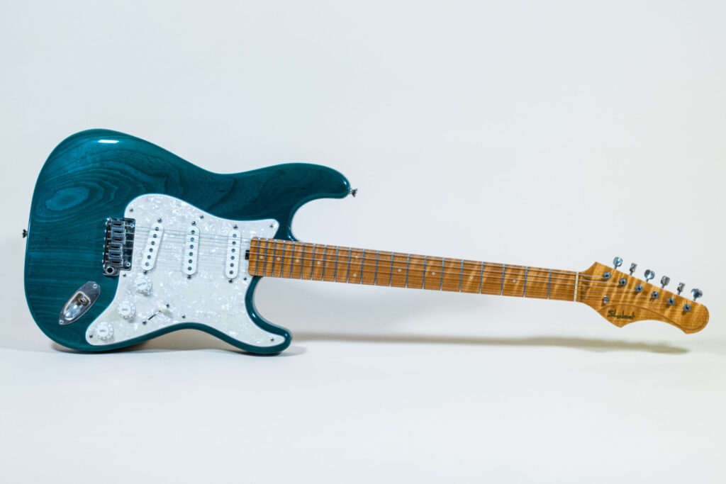 Lynx Translucent Teal Flame Maple Neck