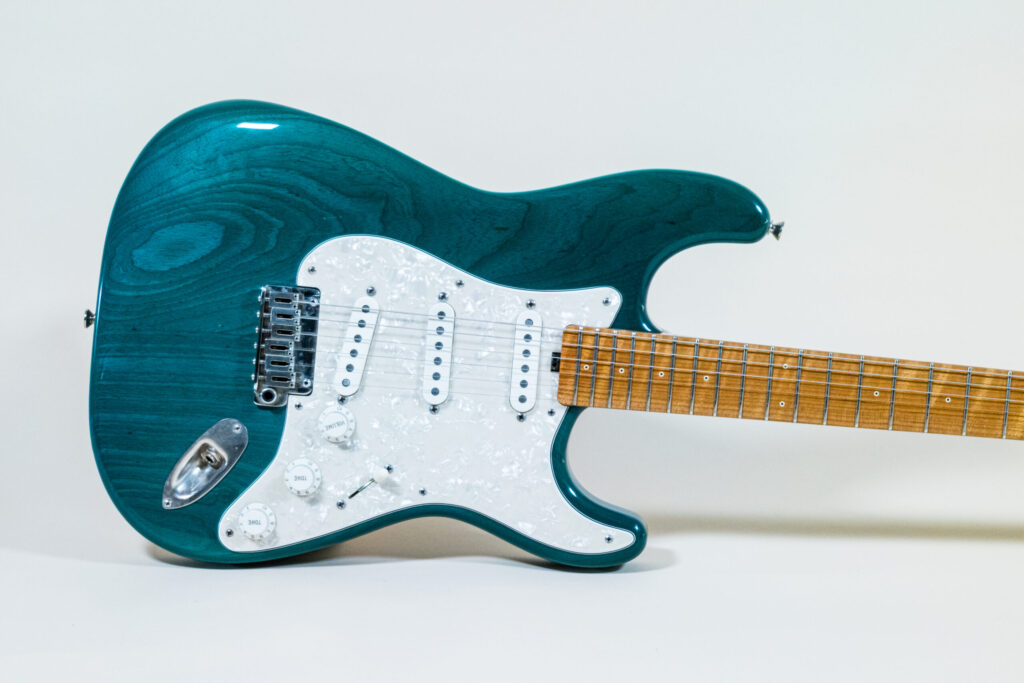 Lynx Translucent Teal Flame Maple Neck