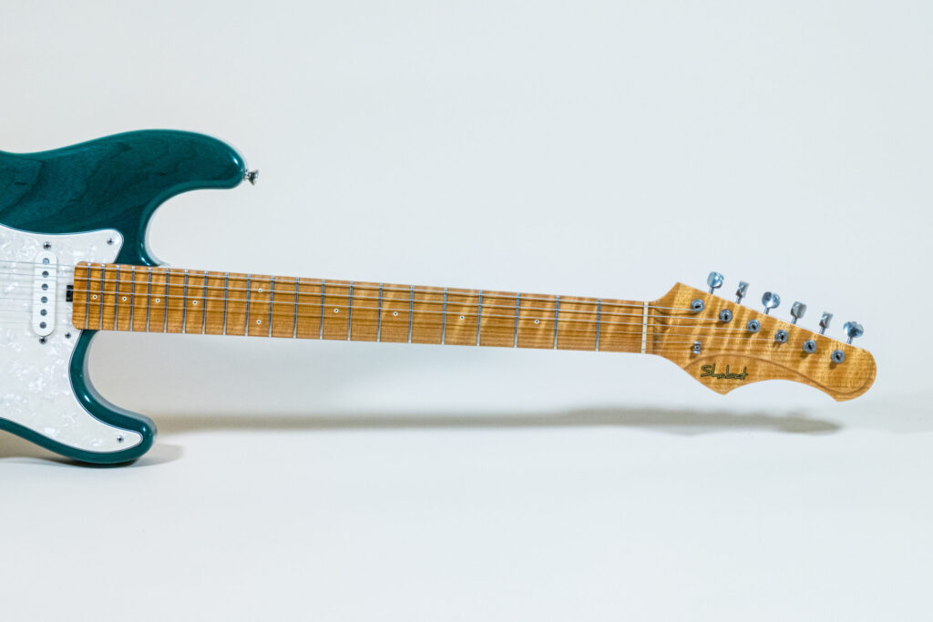Lynx Translucent Teal Flame Maple Neck