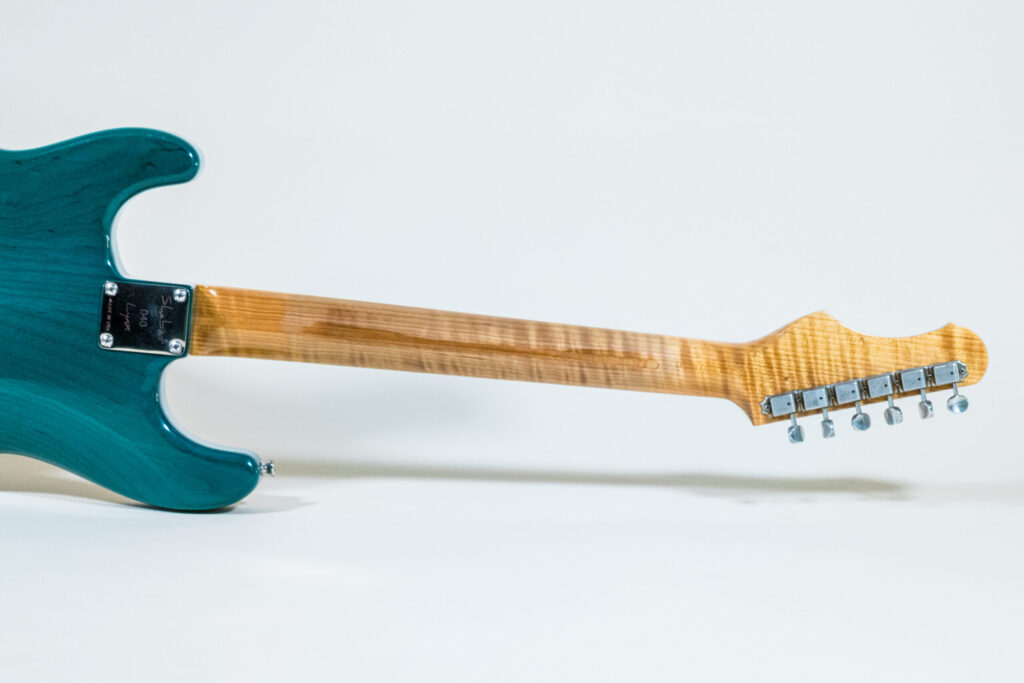 Lynx Translucent Teal Flame Maple Neck
