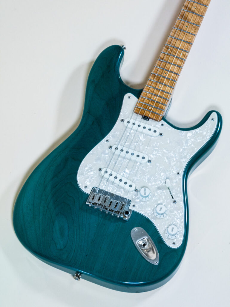 Lynx Translucent Teal Flame Maple Neck