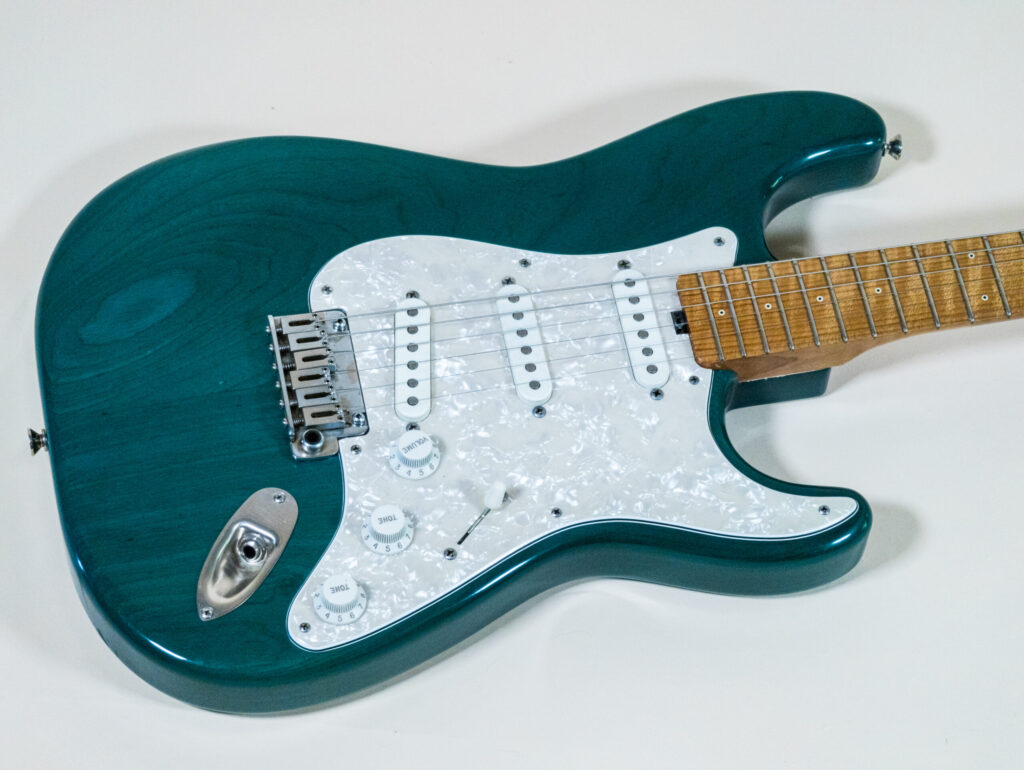 Lynx Translucent Teal Flame Maple Neck
