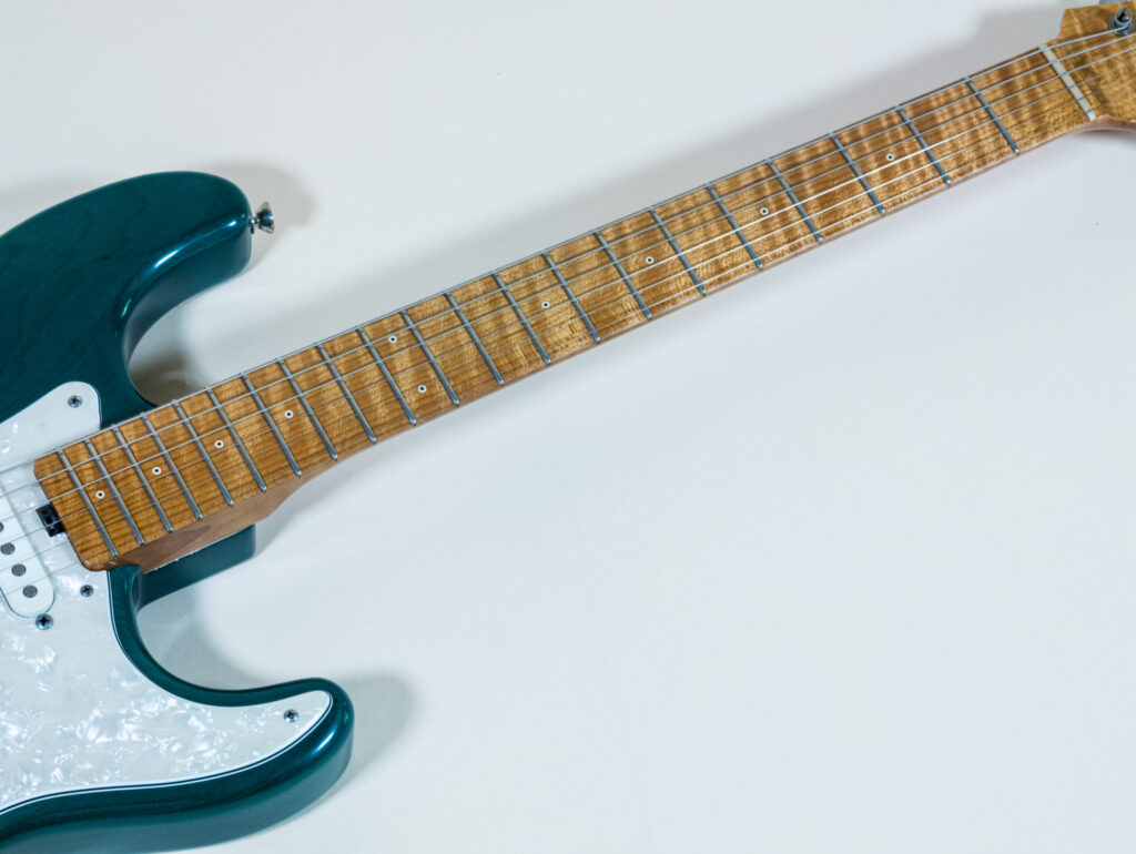 Lynx Translucent Teal Flame Maple Neck