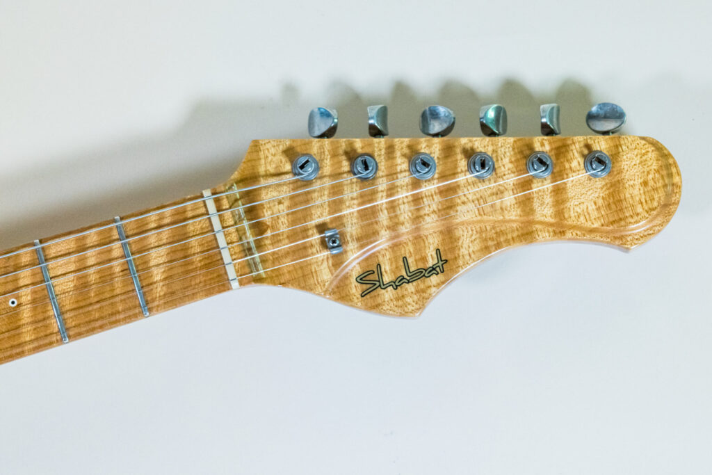 Lynx Translucent Teal Flame Maple Neck