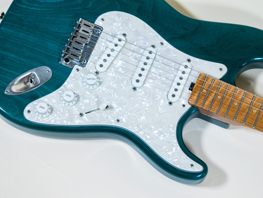 Lynx Translucent Teal Flame Maple Neck