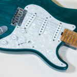 Lynx Translucent Teal Flame Maple Neck