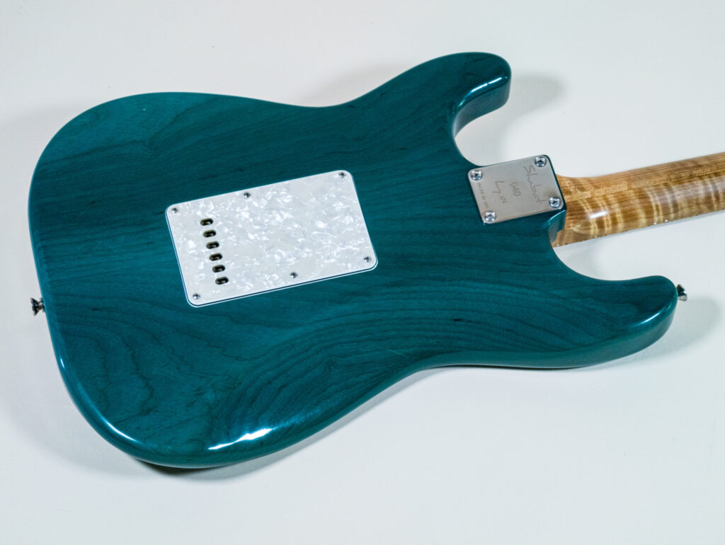 Lynx Translucent Teal Flame Maple Neck