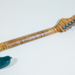 Lynx Translucent Teal Flame Maple Neck