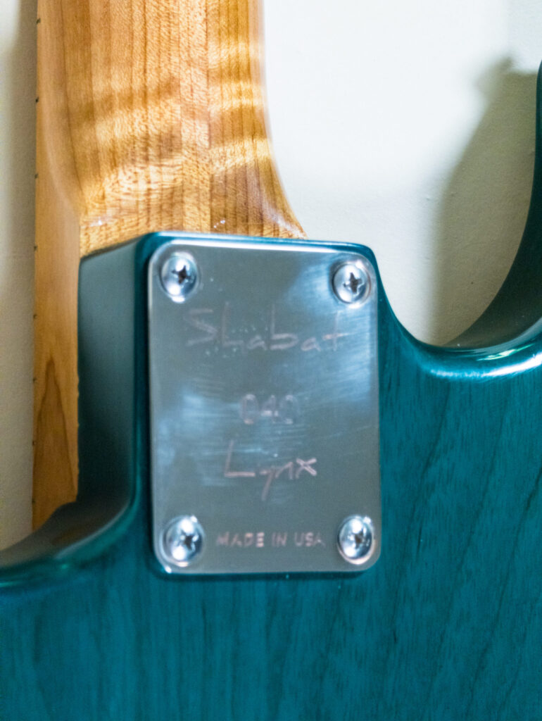 Lynx Translucent Teal Flame Maple Neck
