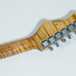 Lynx Translucent Teal Flame Maple Neck
