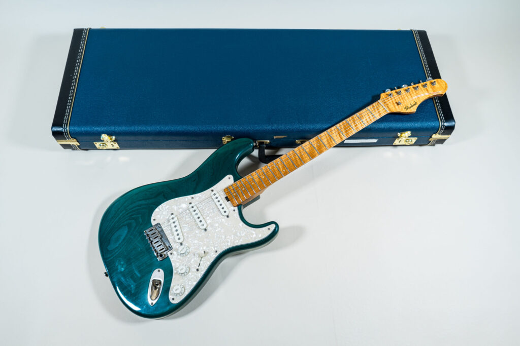 Lynx Translucent Teal Flame Maple Neck